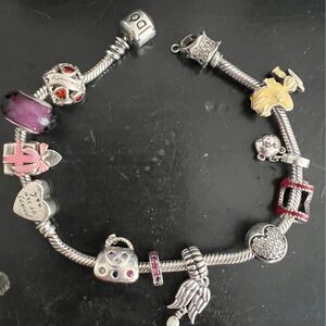 Women’s Pandora sterling silver bracelet with 12 charms
